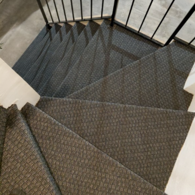 Carpeted stairs on spiral staircase